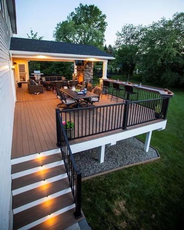 Deck at dusk with string lights and a pergola