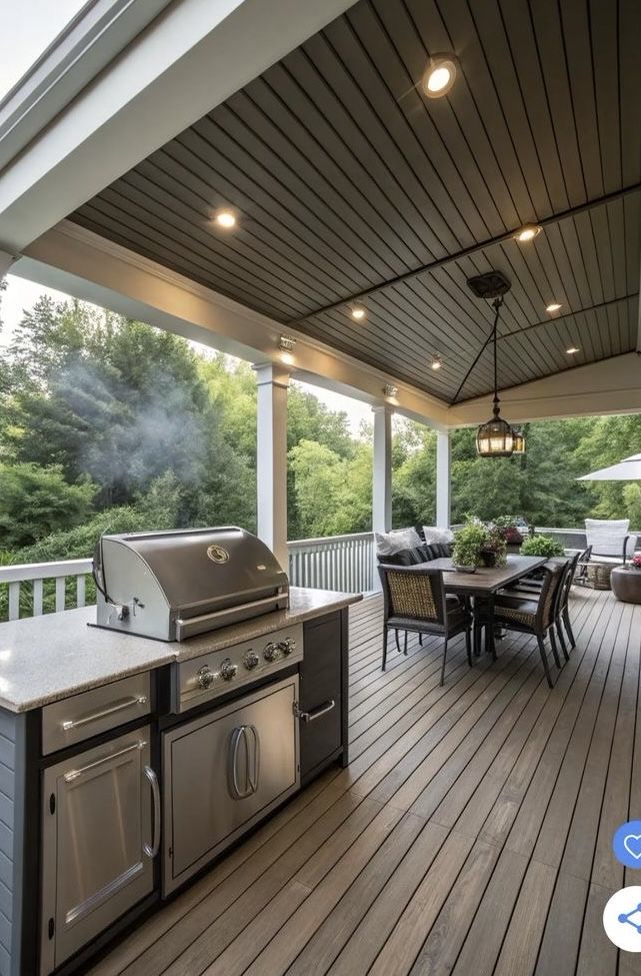 Covered porch with outdoor kitchen and slat ceiling